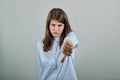 Human hand thumb down, no okay sign, angry face, negative gesture dislike Royalty Free Stock Photo