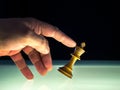 Human Hand Tips a White King Chess Piece Royalty Free Stock Photo