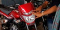 human hand touching bike headlights mask design at bajaj showroom in India aug 2019