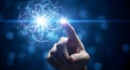 Human hand touching a glowing sphere representing technology and innovation in the digital world Royalty Free Stock Photo
