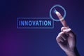 A human hand touching the virtual screen with an innovation symbol Royalty Free Stock Photo