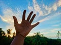 Human hand trying to touch the blue sky Royalty Free Stock Photo