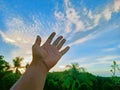 Human hand trying to touch the blue sky Royalty Free Stock Photo