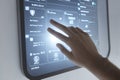 Human hand using futuristic touchscreen interface with digital dashboard and smart technology concept Royalty Free Stock Photo
