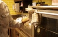 Human hand using hot oven with kitchen towel