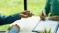 Human hand working with documents at close-up table signature document Emphasis on female hand pen, sign official documents, conta Royalty Free Stock Photo