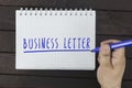 Hand writing on notepad: business letter