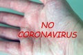 Human hand with a "No coronavirus" message, the concept of Stop Covid