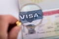 Human Hand Zooming At Visa Text Royalty Free Stock Photo