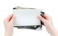 Human hands holding batch of the vintage photos isolated on whit Royalty Free Stock Photo