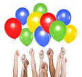 Human Hands Holding a Colourful Balloons