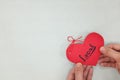 Human hands holding a red heart tag with handwritten word local. Support, promote, buy, shop and love local business concept. Royalty Free Stock Photo