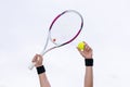 Human hands holding tennis ball and a racket on background of th Royalty Free Stock Photo