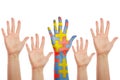 Human hands, one patterned with many puzzle pieces of different colors. Autism awareness cocept Royalty Free Stock Photo