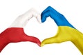 Human hands, painted with Poland and Ukraine flags, forming heart shape