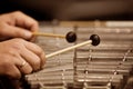 Human hands playing a glockenspiel Royalty Free Stock Photo