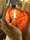 Human Hands protect a victim candle
