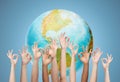 Human hands showing ok sign over earth globe Royalty Free Stock Photo