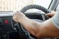 Human hands on the steering wheel. An ordinary person driving a car. Driving, transportation, travel, adventure Royalty Free Stock Photo