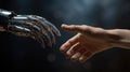 The human hands touch the robot\'s metallic hand. Concept of harmonious coexistence of humans and AI technology