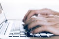 Human Hands typing on laptop in blurred motion with copy space a Royalty Free Stock Photo