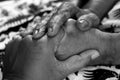 Human holding hands full of love affection in black and white background. Senior Asian women, mother and daughter, holding hand