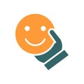 Human holding happy emoji colored icon. Share a good mood, emotions of satisfaction symbol