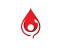 Human holding leaf inside red liquid blood droplet