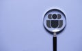 Human icon inside of magnifier glass on blue background for customer focus and Customer relation management or CRM concept Royalty Free Stock Photo