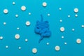 Human intestines with pills on a blue background. Diarrhea and constipation. Stitches and stomach discomfort