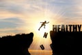 Human jumping over cliff mountain and healthy , Unhealthy wording