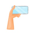 Human left hand holding mobile phone horizontally. Modern gadget. Smartphone with blue screen. Flat vector icon