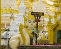 A Human-Lion sculpture and a Buddha statue at Shwedagon Pagoda Royalty Free Stock Photo