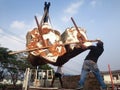 human loading cut tree trunks imitation on Great white auto truc