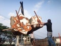 human loading cut tree trunks imitation on Great white auto truc