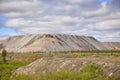 Human-made hills out of soil from an open mine