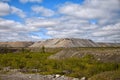 Human-made hills out of soil from an open mine