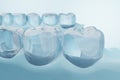 Human molar teeth and gums with blue background