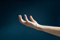 Human open empty hands with light on dark background, blurred and soft Royalty Free Stock Photo