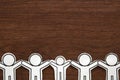 Group of people holding hands on wood. Teamwork concept. Social Network concept. Royalty Free Stock Photo