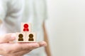 Human resource management and recruitment business concept, Hand holding wooden cube block on top pyramid with human icon Royalty Free Stock Photo