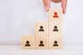 Human Resource Management and Recruitment Business Concept, Hand Putting Wooden Cube Block on Top Pyramid, Copy Space Royalty Free Stock Photo