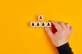 Human resources and employment concept with male hand arranging wooden blocks with manager and staff icons Royalty Free Stock Photo