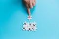 Human resources management and recruitment business build team concept. Image of tangram puzzle blocks with people icons over Royalty Free Stock Photo