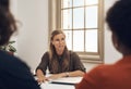 Human resources manager meeting with colleagues, settling a dispute or argument in her office. Serious female leader Royalty Free Stock Photo