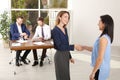 Human resources manager shaking hands with applicant during job interview in offic Royalty Free Stock Photo