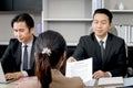 Human resources officer receiving CV resume from candidate woman who looking new job, two businessman managers interviewing new Royalty Free Stock Photo