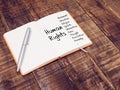Human rights concept. human rights mind map with hand writing on note book at the wooden table Royalty Free Stock Photo