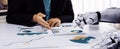 Human and Robot Collaboration in Business Analysis with Charts and Graphs Representing Modern Technology and Data Royalty Free Stock Photo