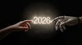 Human and Robot Hand Reaching for the Future Year 2026 in a Dark Creative Concept Royalty Free Stock Photo
